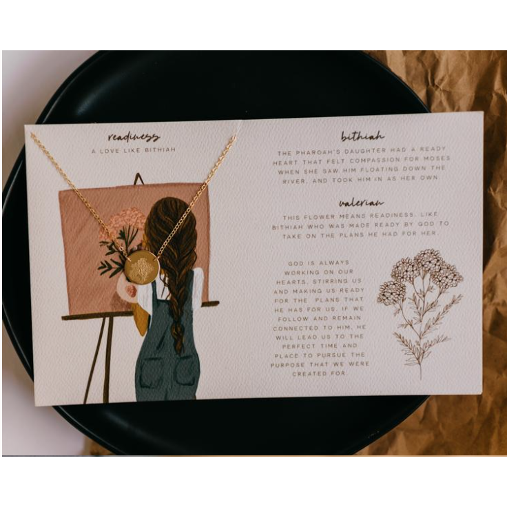 Informational card with illustrations and text about the attached necklace
